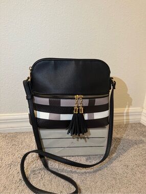 Black Crossbody Bag with Striped Accent and Tassel
